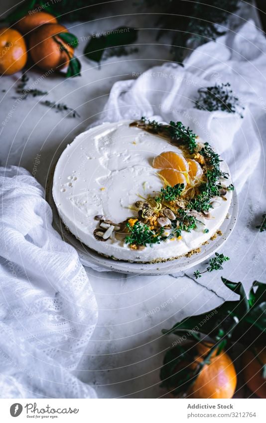 Tangerine cake decorated with whipped cream and sliced citrus bakery delicious tangerine tasty dessert sweet knife spoon orange gourmet fruity cookie fresh pie