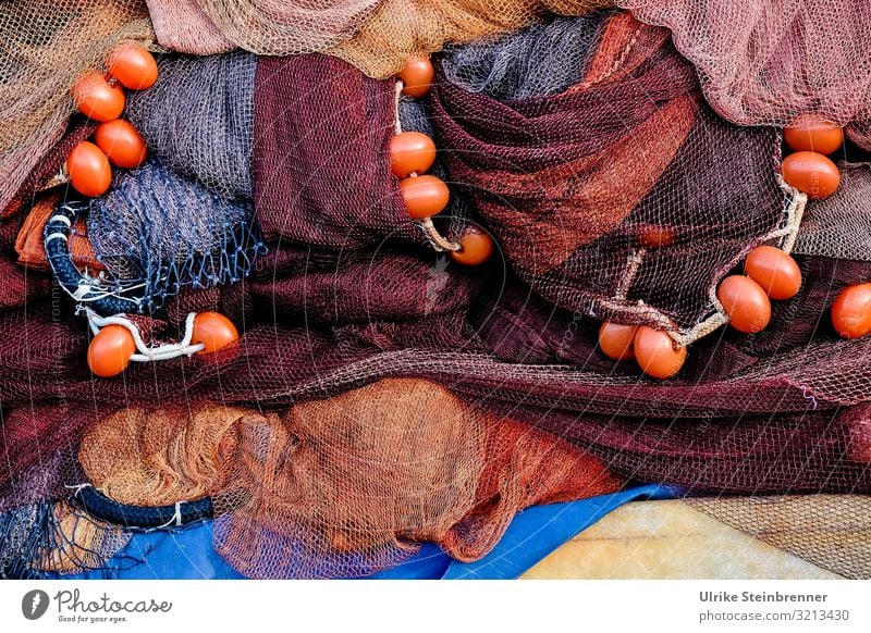 Fishing nets on the quay in red Rope Plaited Net fishing Fishing industry Sardinia Colour photo Exterior shot Fishery Structures and shapes Detail Knot Close-up