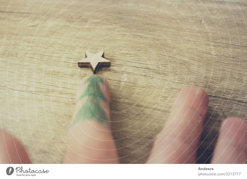 Christmas decoration with a small star and a Christmas tree painted on a finger on a wooden base Feasts & Celebrations Christmas & Advent by hand Fingers Simple