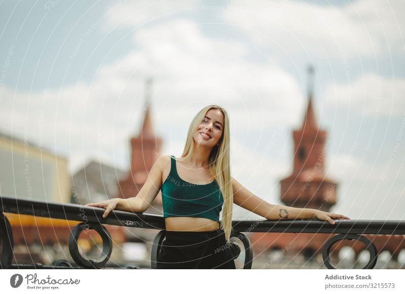 Beautiful blonde woman leaning on railing model beautiful berlin young fashion stylish trendy female gorgeous elegant urban charming feminine sightseeing city