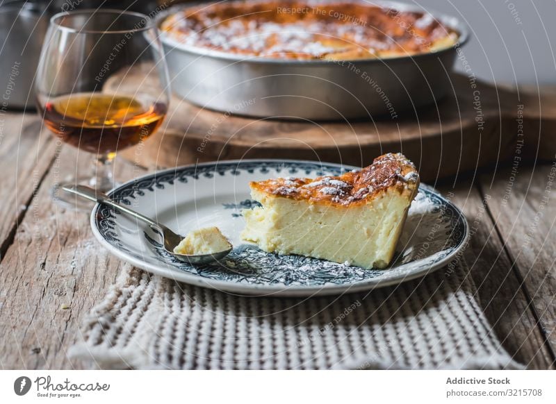 Cottage cheese pudding and glass of cognac casserole brandy baked cooking food beverage alcohol cottage dessert homemade piece prepared delicious appetizing