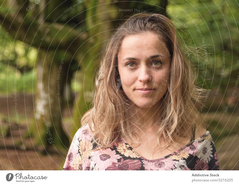 Portrait of young attractive woman against forest portrait dreamy beautiful green eyes tree moss female pretty cute model positive casual confident natural