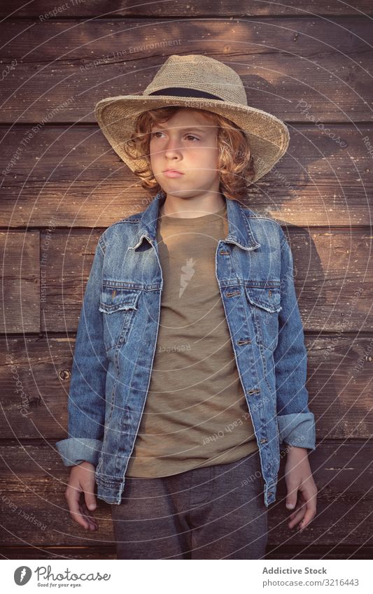 Little boy standing near wooden cabin kid little fun casual summer funny child active freedom adorable innocent holidays childhood merry lifestyle rural sunny