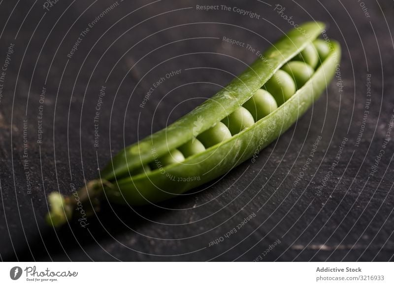 Fresh peas and pea pods on dark background ecological food fresh green healthy legume natural organic raw seed vegetable vegetarian harvest nutrition ingredient