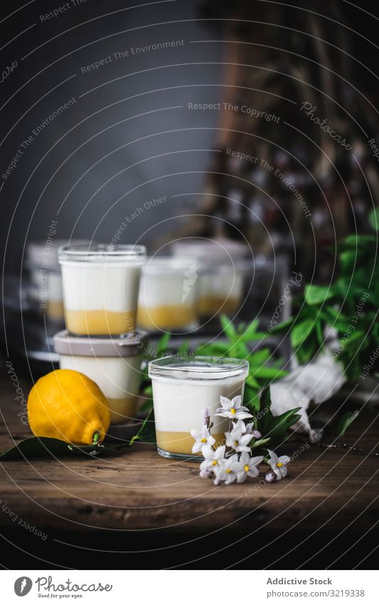 Homemade yoghurt with lemon curd Lemon Yogurt Healthy Lemon Curd Dessert sweet homemade yellow citrus dark background food white leaf glass wooden table rustic