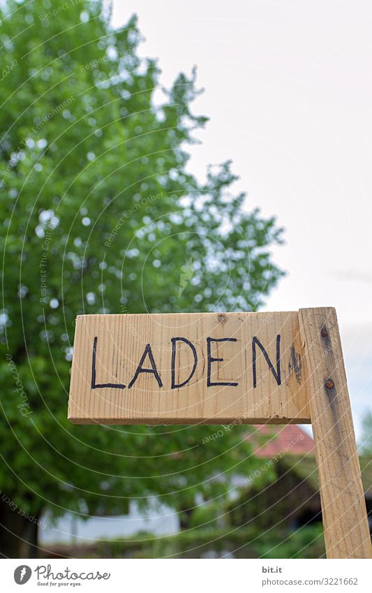 Written l Shop sign Sign Characters Signs and labeling Contentment Joie de vivre (Vitality) Store premises Text Sell Day Shallow depth of field