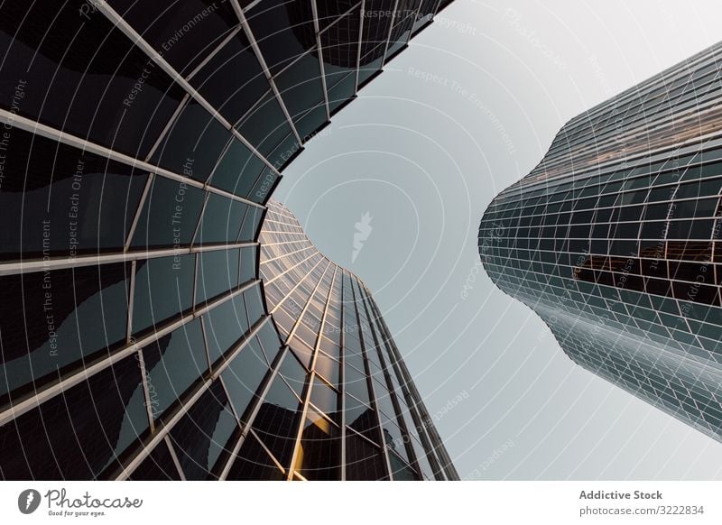 Round geometric building of business center with mirrored walls futuristic architecture development urban construction structure office reflection design