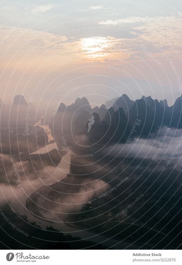 Mysterious river landscape among high mountains in haze mysterious mist sky fog cloud nature travel humid natural picturesque view scenic water environment