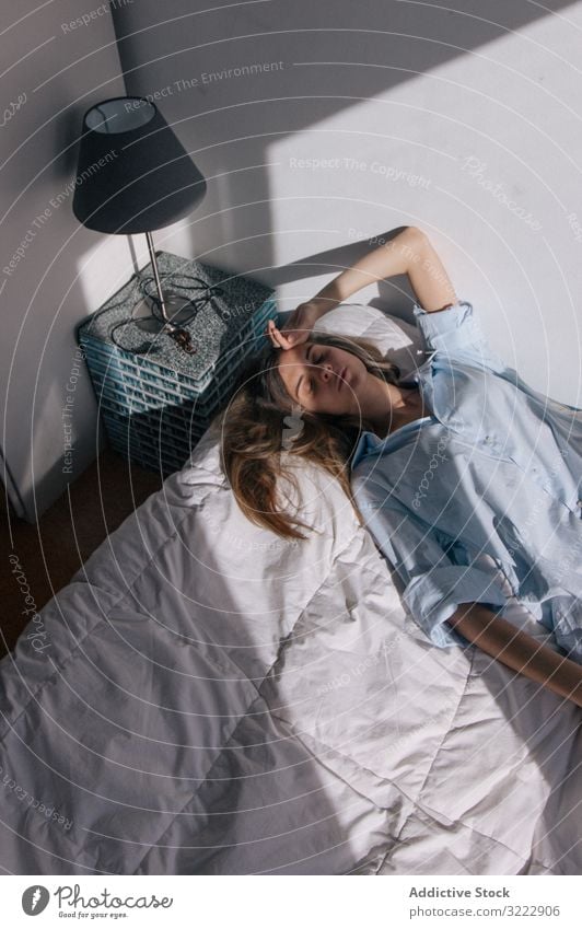 Pensive woman lying down on bed melancholy tender pensive solitude frustration long haired tired alone thoughtful calm sensual attractive depression soft female