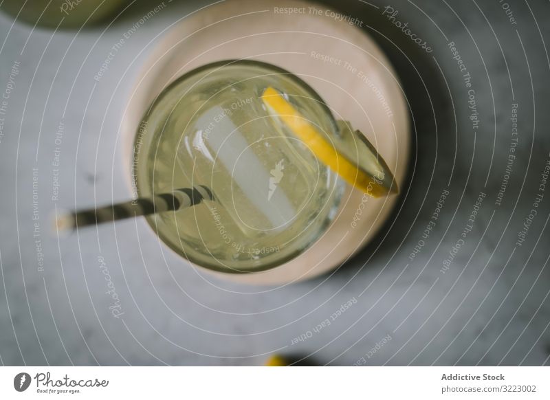 Delicious elderflower syrup in glass and bottle lemonade homemade citrus fruit beverage drink refreshment cold delicious tasty liquid straw served cooked