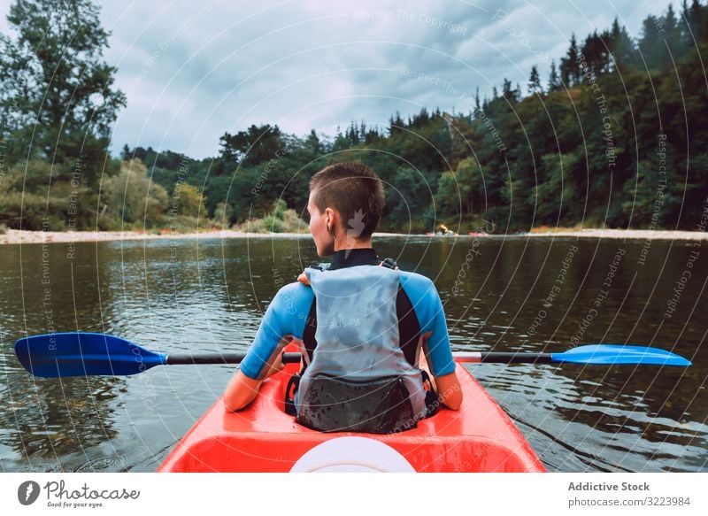 Female kayaking with paddle in raised hands woman sport sella river spain water canoe activity tourism adventure lifestyle travel female joyful athletic fit