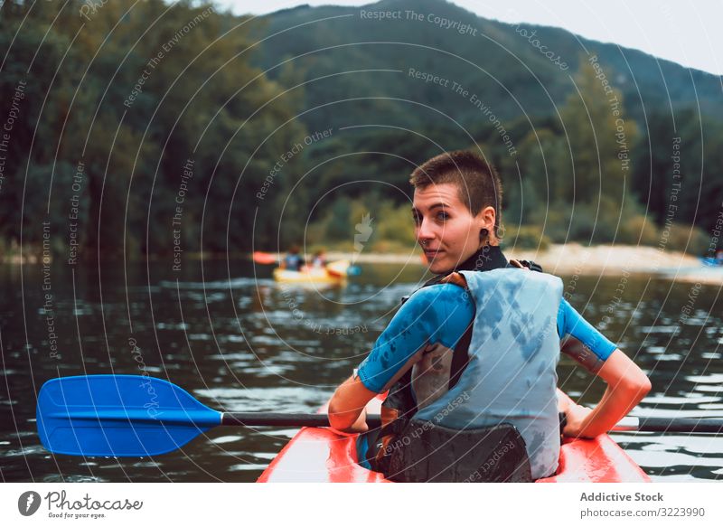 Female kayaking with paddle in raised hands woman winner competition sport sella river spain water canoe activity tourism adventure lifestyle travel female