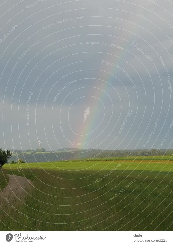 rainbow Rainbow Field Landscape Sky Clouds in the sky Cloud cover Horizon Deserted Far-off places Natural phenomenon Refraction