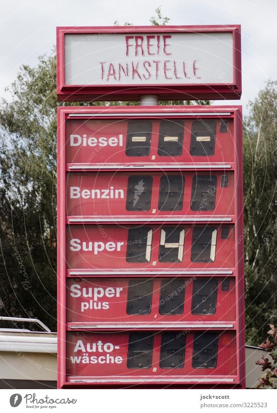 Independent petrol station Petrol station Energy crisis Kreuzberg Display Gasoline Plastic Price list Word Typography Sharp-edged Broken Retro Red End