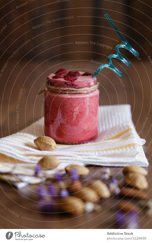 Healthy fruit vegetarian meal smoothie raspberry almond milk healthy breakfast organic jar glass table rustic diet food fresh drink natural nutrition raw vegan