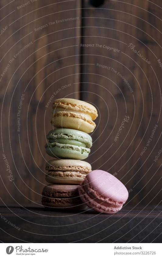 Stack of fresh crunchy macaroons stack dessert colorful snack food wall wooden biscuit sweet gourmet assorted pastry confection traditional delicious tasty