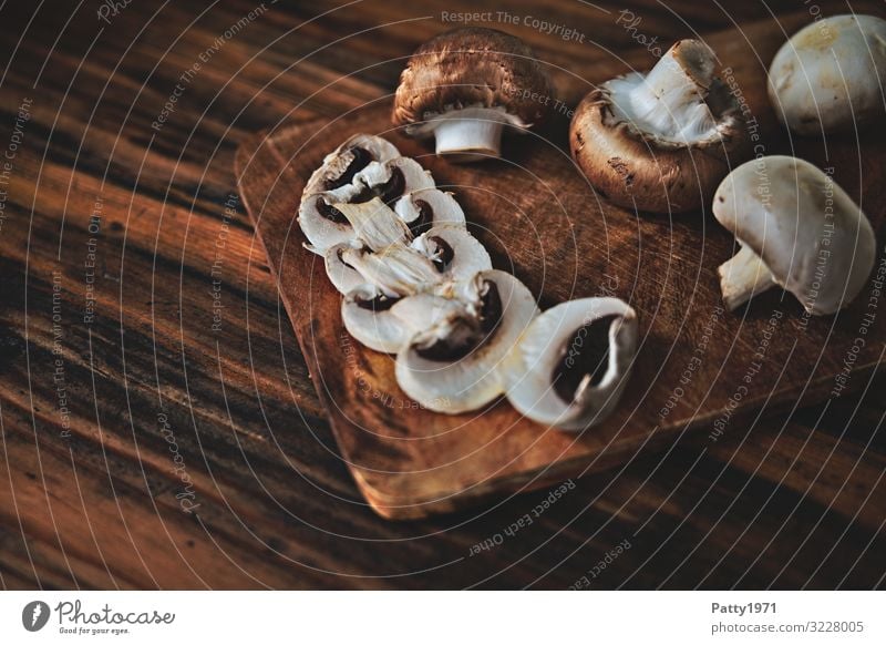 Mushrooms on a wooden chopping board Food Button mushroom Nutrition Organic produce Vegetarian diet Chopping board Fresh Delicious Brown To enjoy