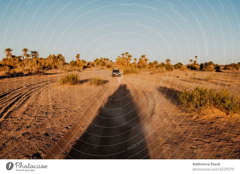 Road trip on cloudy day road vehicle sky hill plain morocco africa weather nobody car vacation journey travel tourism transport windshield windscreen highway