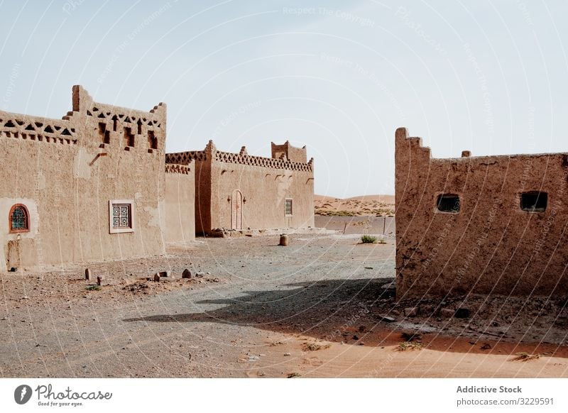 Traditional Arab houses on town street traditional arab culture exterior morocco africa sky cloudless architecture ornament building grungy weathered structure