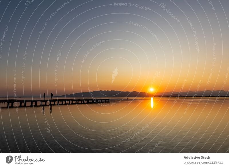 Romantic scene of a couple at sunset people romantic catalonia spain ebro delta mediterranean idyllic sunset water reflection sundown paradise sunbeam travel