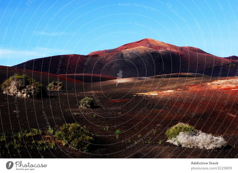 Picturesque view of volcanic terrain with solidified lava in wild area landscape deserted island burnt spain nature picturesque travel horizon scenic slope