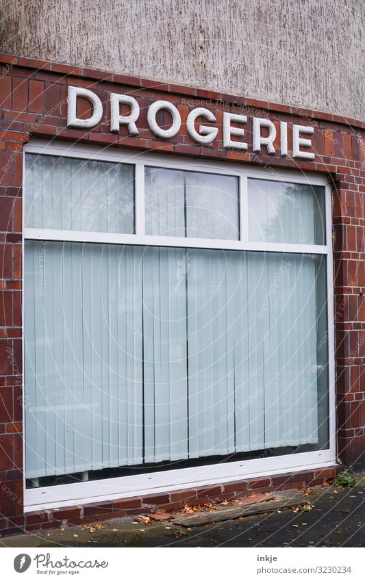 Behind closed curtains Trade Services Health care Drugstore Village Small Town Deserted Store premises Facade Window Shop window Old Authentic Gloomy Transience