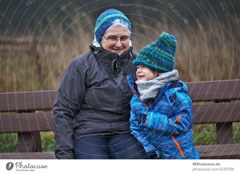 Grandma and grandchild on a bench Human being Masculine Feminine Child Boy (child) Woman Adults Female senior Grandmother Infancy 2 3 - 8 years