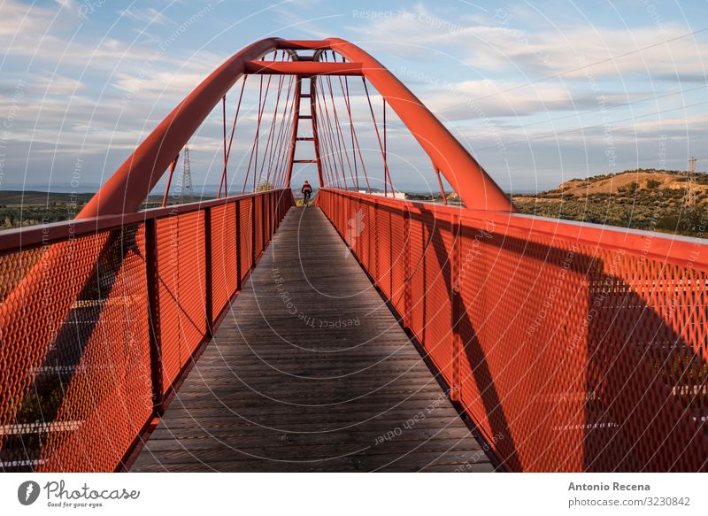 elevated red bridge over the highway with cyclist traveling Sports Cycling Landscape Sky Bridge Architecture Pedestrian Street Highway Overpass Wood Steel Red