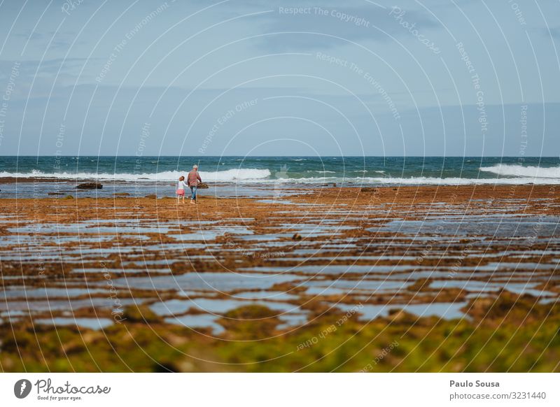 Grandfather and grand daughter walking in the beach Lifestyle Vacation & Travel Tourism Summer vacation Beach Ocean Human being Masculine Feminine Girl 2