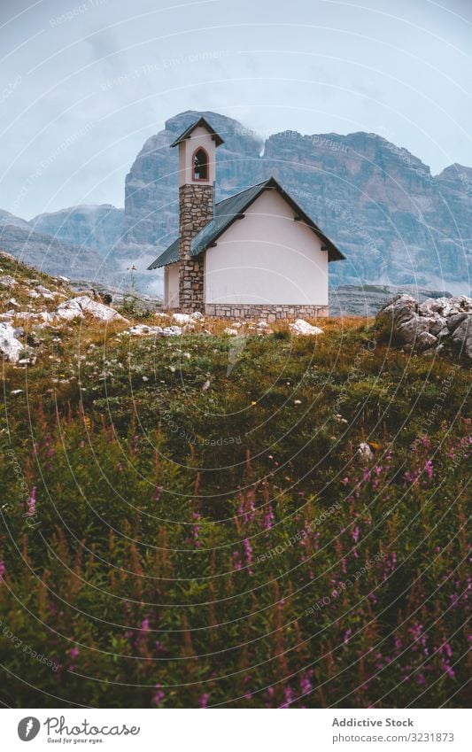 Hotel on cliff during cloudy weather hotel mountain dolomites hill italy tourism alpine rock resort travel alps solitude rest tre cime trip height vacation