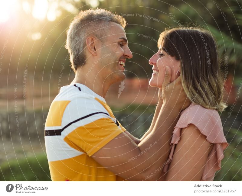 Happy couple looking at each other love smile happy vacation sunny daytime man woman adult honeymoon summer nature shore coast relationship holiday tropical