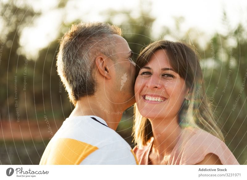 Happy couple looking at each other love smile happy vacation sunny daytime man woman adult honeymoon summer nature shore coast relationship holiday tropical