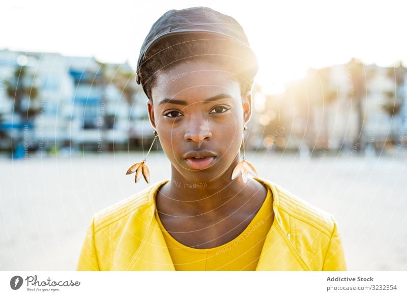 Portrait of a black woman stylish african american female jacket bright cute attractive positive healthy charming young pretty modern cheerful relax chill rest