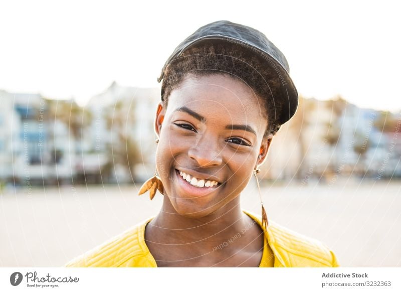 Joyful female smiling at camera woman stylish african american smile jacket bright cute attractive positive healthy charming young pretty modern cheerful laugh