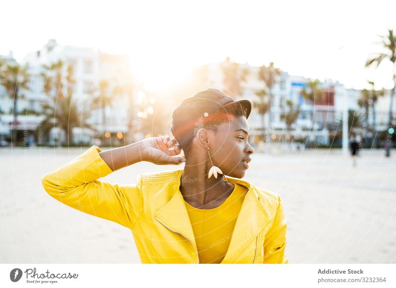 Portrait of a black woman stylish african american female jacket bright cute attractive positive healthy charming young pretty modern cheerful relax chill rest