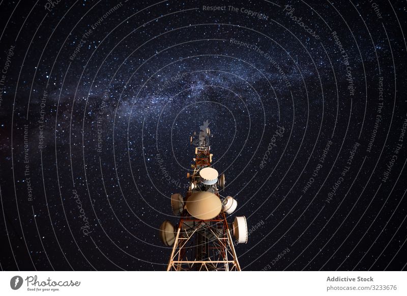 Amazing view of transmission towers against Milky Way in night sky milky way antenna star silhouette galaxy high voltage telecommunication connection height