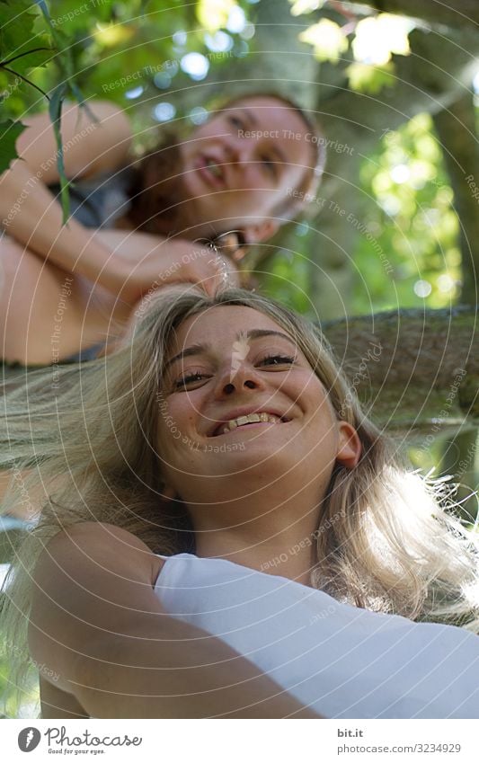 In the tree. Contentment Senses Relaxation Calm Playing Vacation & Travel Human being Feminine Young woman Youth (Young adults) Brothers and sisters Sister