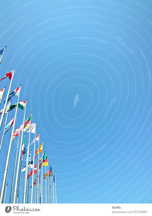 EU - flags Europe waving flags European parliament Attachment Strasbourg Sign stick together Future at the same time Alliance symbol Together Blue sky