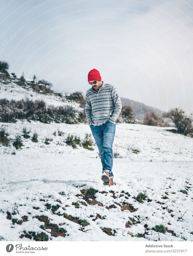 Man walking on winter field man snow relaxation enjoy country forest recreation alone meadow hill tree frozen quiet calm tranquil cold nature valley journey