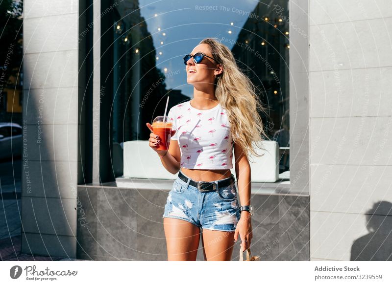 Stylish woman enjoying healthy drink on street smile city summer lifestyle urban female stylish trendy rest relax juice smoothie detox vitamin fruit lady