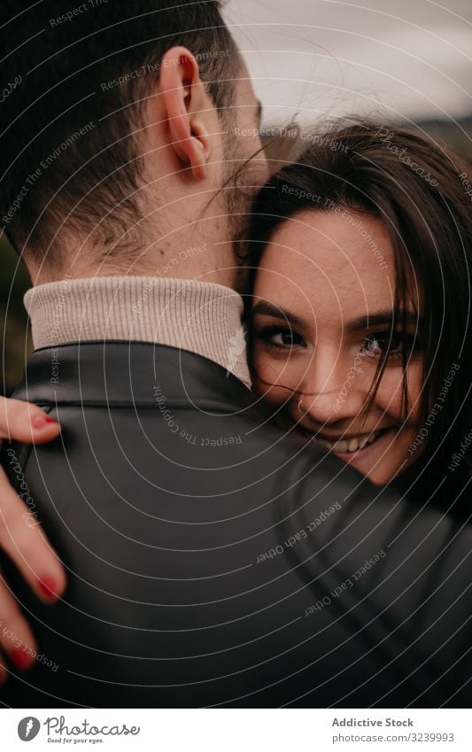 Happy couple hugging coniferous love date happy passion glad forest relationship romance intimate smile pleasure caress embrace enjoy gentle affection