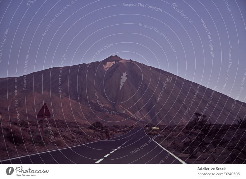 Close-up of a road in Tenerife, Spain mountain landscape journey volcano asphalt surrounded rocky el teide tenerife spain canary island adventure distance sky