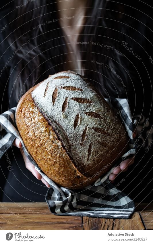 Crop person holding some bread fresh seed show meal food cuisine kitchen home snack rustic baked healthy delicious tasty yummy gourmet homemade nutrition