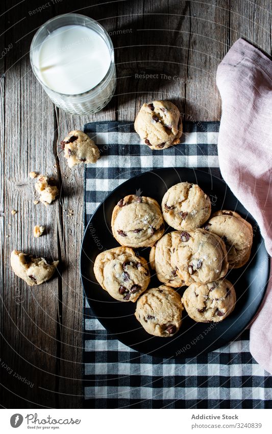 Plate with vegan cookies with chocolate chips milk cloth plate glass home drink beverage food edible meal fabric tasty delicious yummy dairy vegetarian dessert