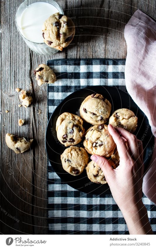 Plate with vegan cookies with chocolate chips milk cloth plate glass home drink beverage food edible meal fabric tasty delicious yummy dairy vegetarian dessert