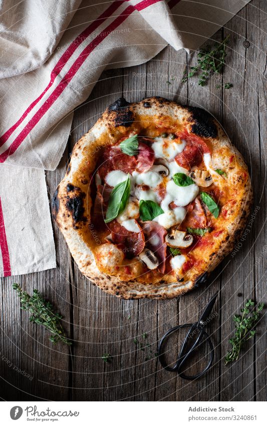 Tasty summer pizza near napkin and scissors traditional table rustic italian gourmet fresh yummy tasty delicious towel cloth fabric herb basil dinner lunch food