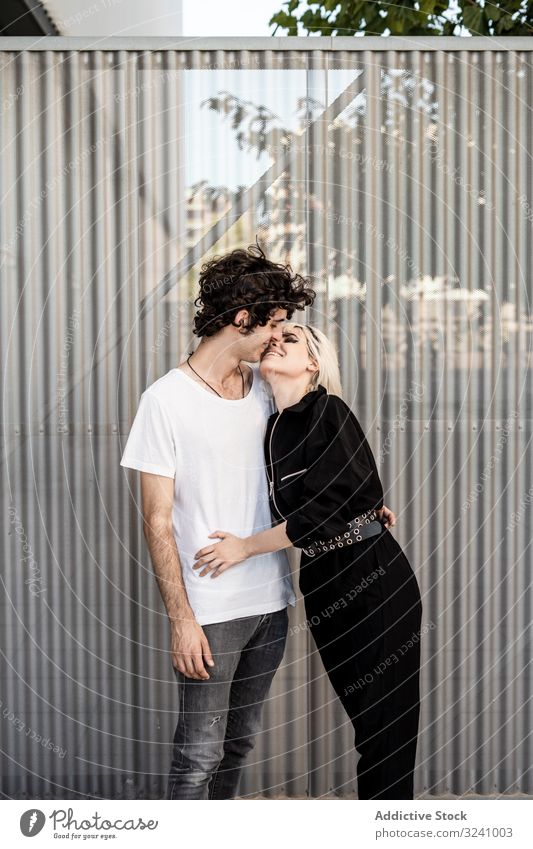 Couple near stripped modern building couple trust support love dream loyalty relationship amour soulmate feelings hope affection romance boyfriend girlfriend