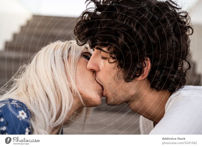 Loving couple kissing on stairs passion love dream intimate pleasure relationship soulmate feelings affection romance trust boyfriend girlfriend gentle together