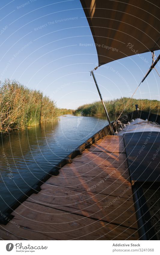 Front of boat riding along sea front lagoon valencia ride modern vessel shade float swim smooth ocean detail shadow travel water landscape vacation tourism