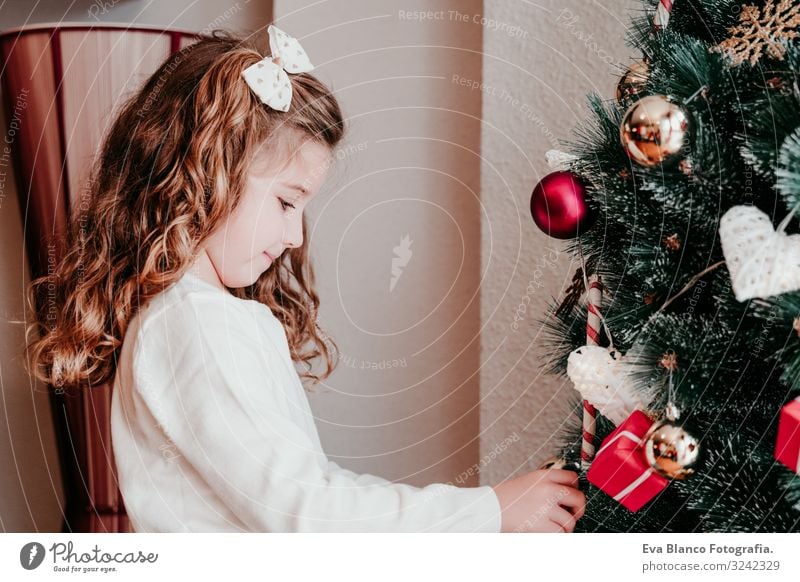 kid girl decorating christmas tree at home Lifestyle Joy Winter House (Residential Structure) Decoration Christmas & Advent Child Feminine Toddler Girl Sister